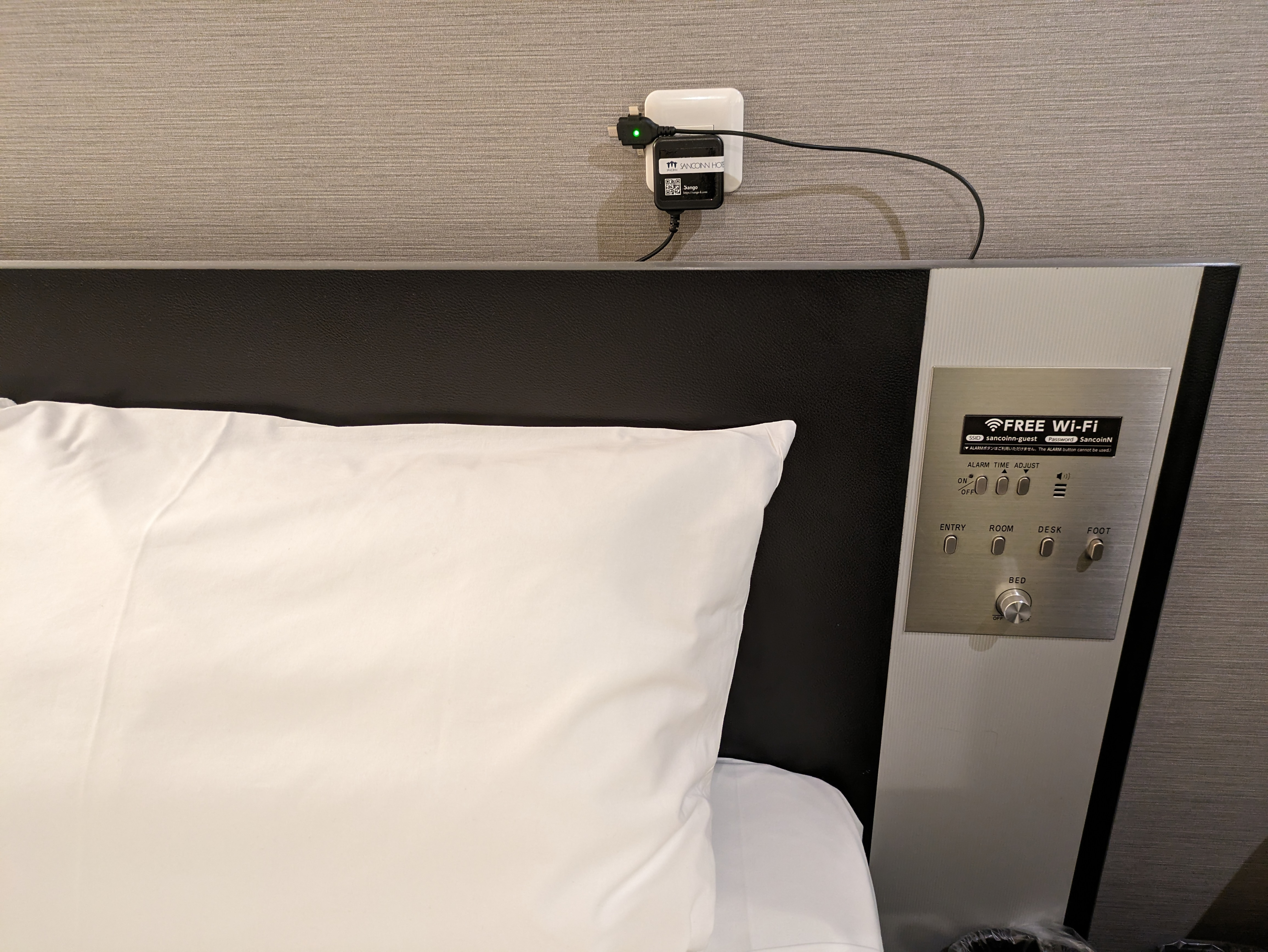 Photo of the bedside electrical outlet and switch in the accessible room